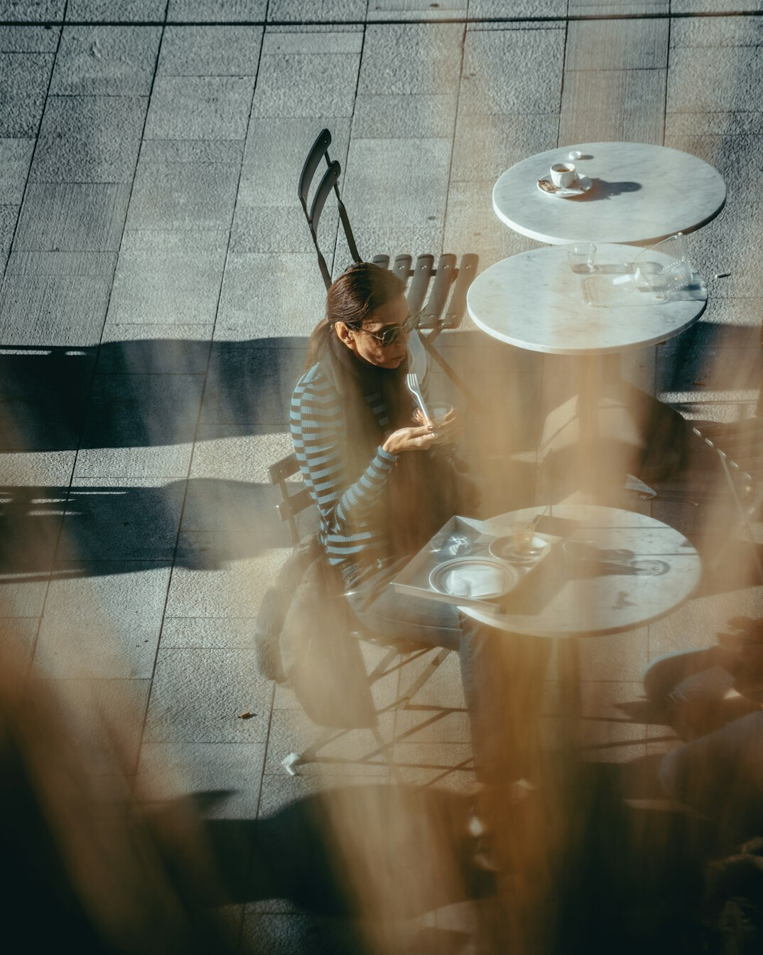 European man working at a desk viewed from above